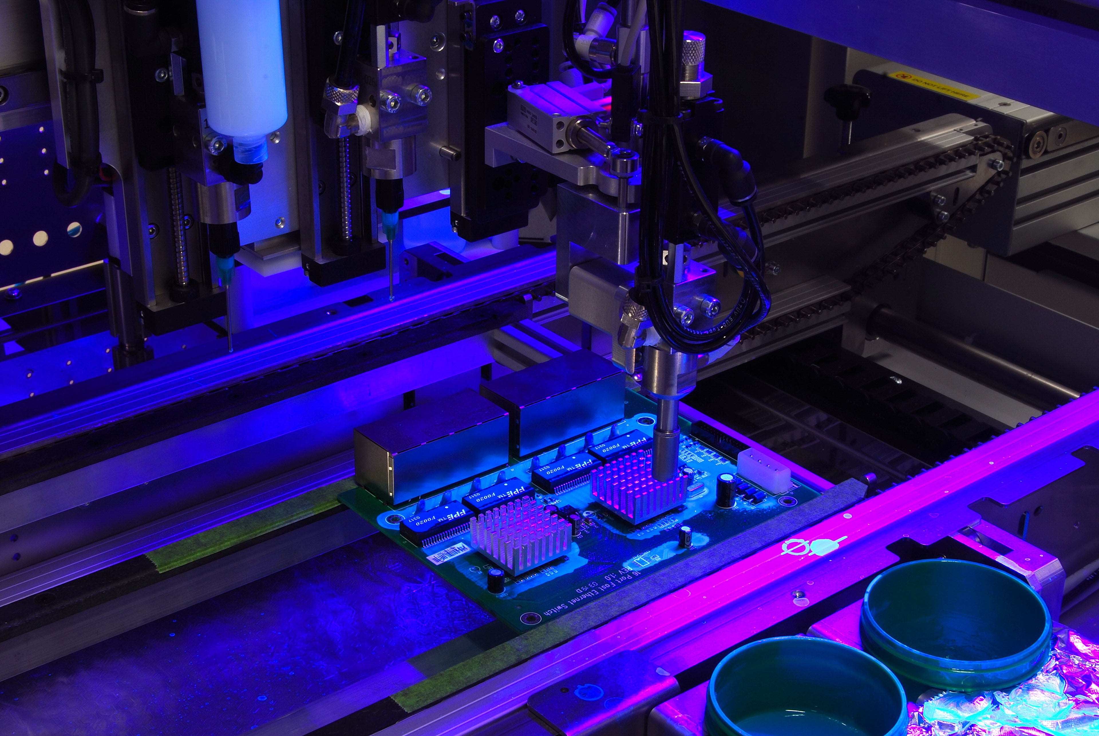 Machine selective conformal coating