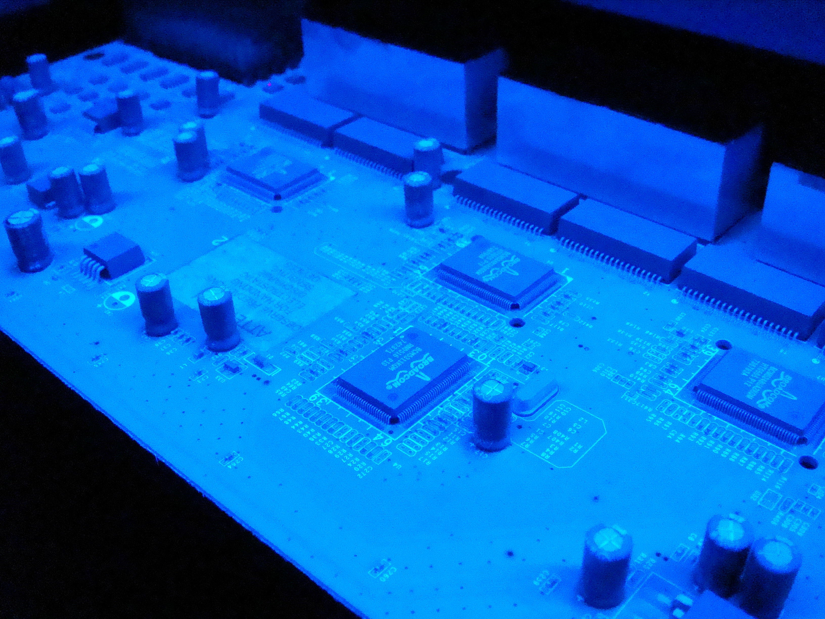 Professional conformal coating application on electronic circuit board with UV tracer